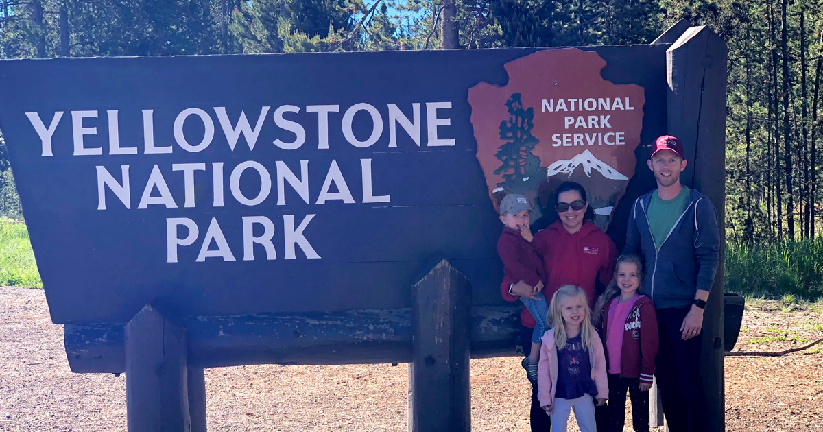 The Evans Family at the Yellowstone Sign